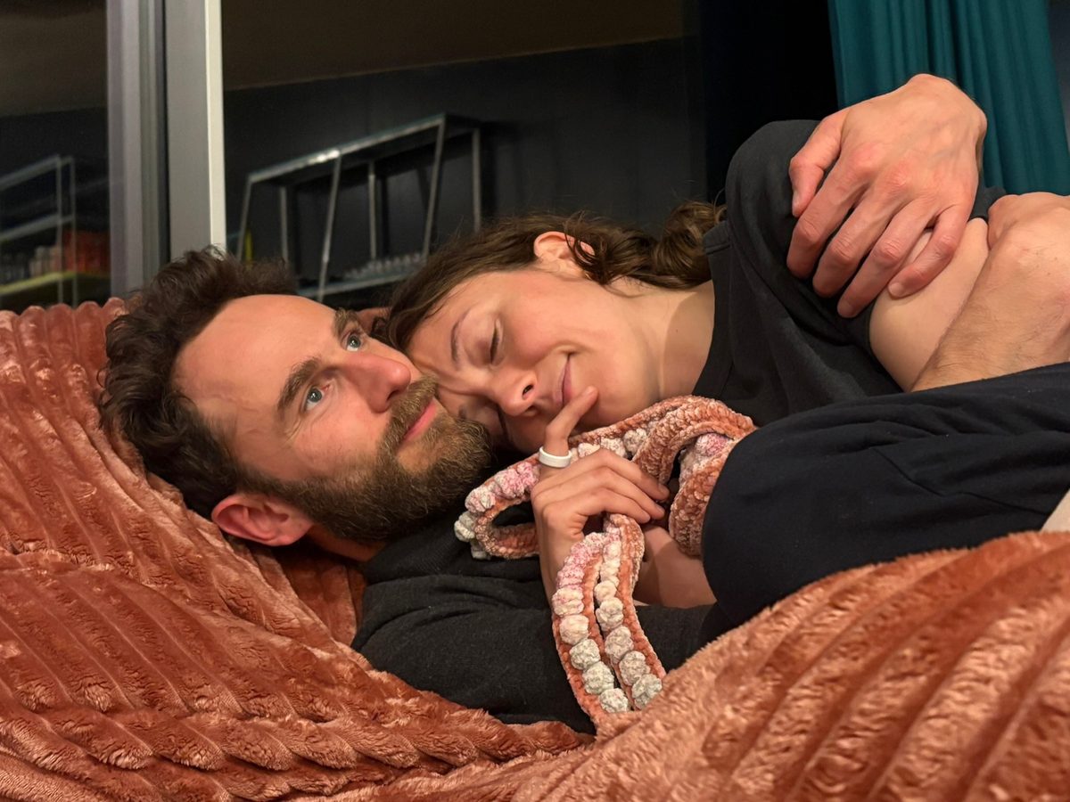 Liza and Adam relaxing with their snake